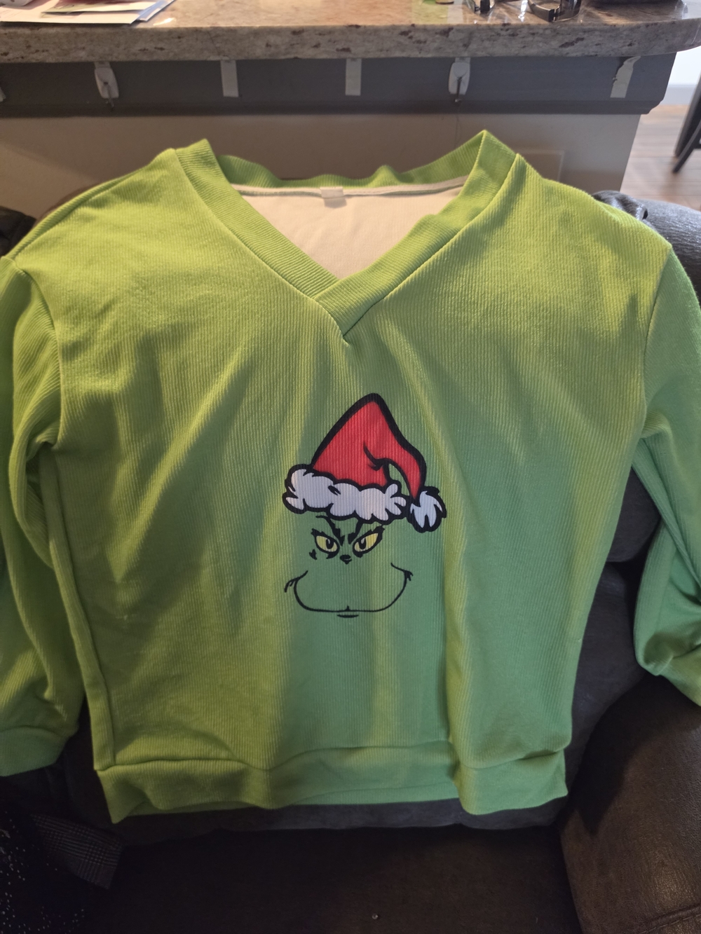 Green Grinch V-Neck Sweatshirt with Red Santa Hat Graphic